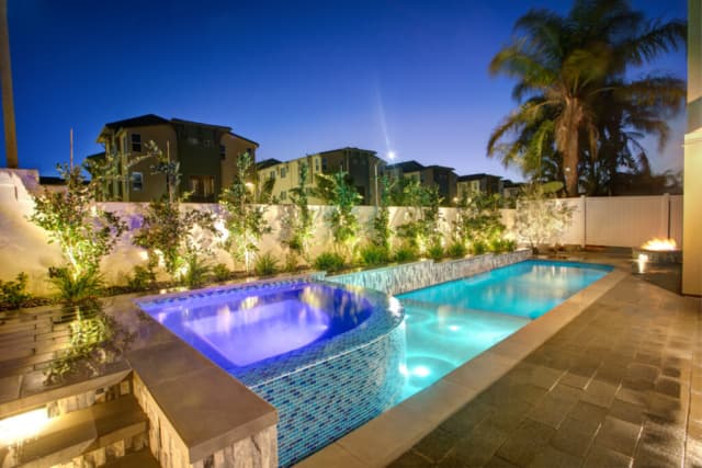 Narrow pool and spa running the length of the yard