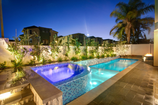 Narrow pool and spa running the length of the yard